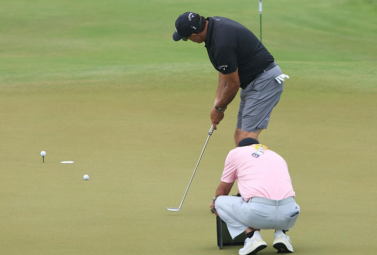 Phil Mickelson works with putting coach Derek Uyeda early in the week of the PGA. Sam Greenwood