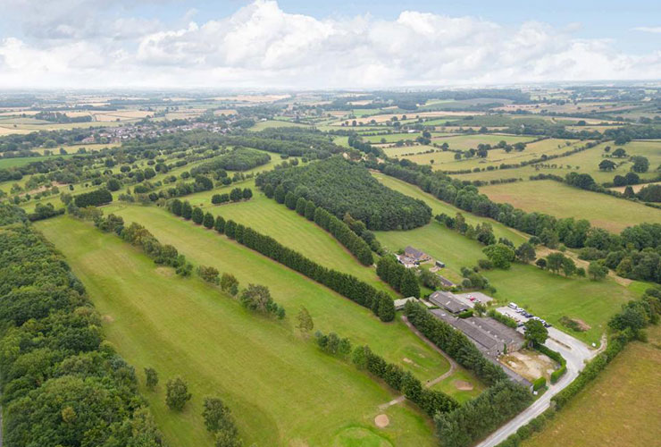 Beautiful four-bedroom bungalow for sale in England that comes with an 18-hole golf course and clubhouse