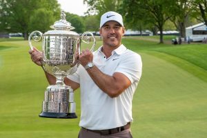 Brooks Koepka (USA) lifts the Wanamaker Trophy after winning the 2023 PGA Championship