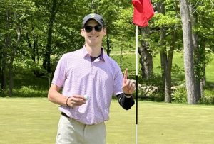 Jack Wiebe celebrates his first par-4 hole-in-one ... of the day