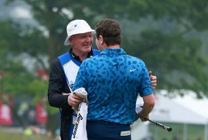 Robert MacIntyre celebrates winning the RBC Canadian Open with his caddie and father Dougie MacIntyre - Vaughn Ridley