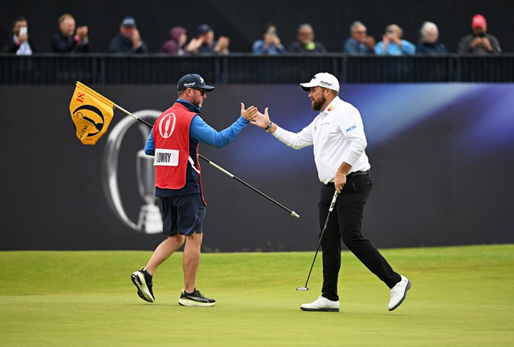 Shane Lowry interacts with caddie Darren Reynolds on the 18th green following his second round at Royal Troon - Stuart Kerr/R&A