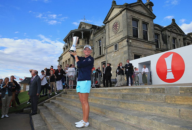 Stacy Lewis lifts the winner's trophy following her victory during the final round of the Ricoh Women's British Open in 2013 - David Cannon