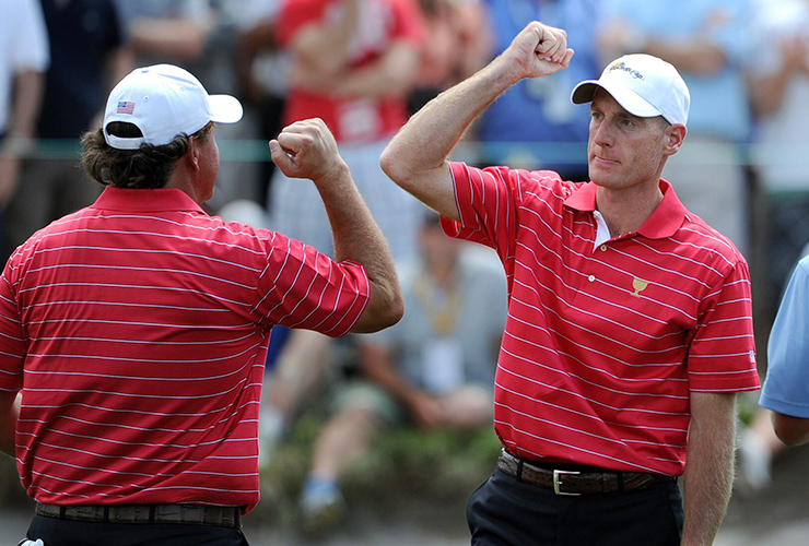 Jim Furyk and Phil Mickelson celebrate during the 2011 Presidents Cup at Royal Melbourne - WILLIAM WEST