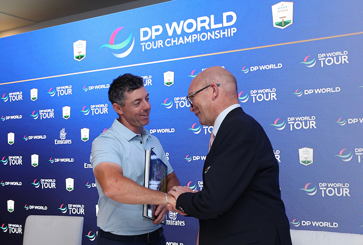 Rory McIlroy shakes hands with DP World Tour CEO Guy Kinnings - Andrew Redington